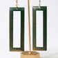 Green open rectangle earrings on a gold stand against a white background